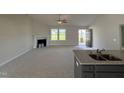 Open living room, kitchen, and fireplace at 139 Grace Ridge Ct, Benson, NC 27504