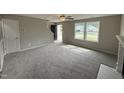 Spacious living room with fireplace and carpet flooring at 54 Bonsai Way, Four Oaks, NC 27524