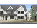 Two story townhome with modern farmhouse style exterior at 2411 Adrift Rd, Fuquay Varina, NC 27526