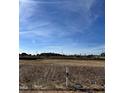 Vacant lot ready for new construction, situated near a road at 2411 Adrift Rd, Fuquay Varina, NC 27526