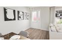 Bright dining area with a modern table and chairs, adjacent to entryway at 2415 Adrift Rd, Fuquay Varina, NC 27526