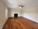 Living room with hardwood floors and fireplace at 27 Pine Croft Rd, Angier, NC 27501