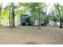 Gray house back with deck and wooded backyard at 3404 Gemini Dr, Raleigh, NC 27604