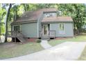 House exterior with a walkway and surrounding trees at 3404 Gemini Dr, Raleigh, NC 27604