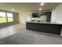 Modern kitchen with granite countertops and gray cabinets at 53 Grace Ridge Ct, Benson, NC 27504