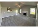 Spacious living room with fireplace and high ceilings at 95 Grace Ridge Ct, Benson, NC 27504