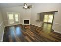 Living room featuring hardwood floors, fireplace, and access to patio at 500 W Woodcroft Pkwy Pkwy # 8C, Durham, NC 27713