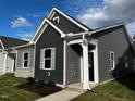 Modern gray house with stone accents and landscaping at 804 Dorset Stream Dr, Fuquay Varina, NC 27526