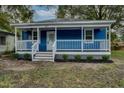 Renovated blue house with a welcoming porch at 915 E Holly St, Rocky Mount, NC 27801