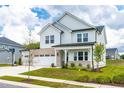 Two-story white house with a two-car garage and basketball goal at 137 Tayberry Ct, Holly Springs, NC 27540