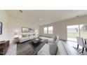 Spacious living room with light walls and comfortable seating area at 360 Glover Park Mem Dr, Nashville, NC 27856