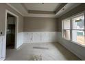 Spacious dining room with white wainscoting and neutral walls at 81 Seahawk Way, Zebulon, NC 27597