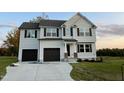 Two story home with a two car garage and landscaped yard at 223 Bonsai Way, Four Oaks, NC 27524