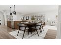 Bright dining area with wooden table and chairs, adjacent to kitchen and living room at 4046 Elk Creek Ln # 62, Raleigh, NC 27612