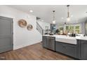 Modern kitchen island with farmhouse sink and gray cabinets at 4047 Elk Creek Ln # 13, Raleigh, NC 27612