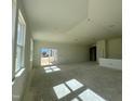 Bright and airy living area with sliding doors to the patio at 77 Frasier Fir Way, Lillington, NC 27546