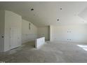Spacious living room with high ceilings and large windows at 77 Frasier Fir Way, Lillington, NC 27546