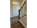 Elegant entryway with hardwood floors and a staircase at 1916 Fishamble St, Fuquay Varina, NC 27526