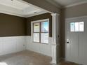 Bright dining room with wainscoting and large windows at 970 Olive Branch Dr, Smithfield, NC 27577