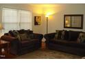 Spacious living room with two couches and wood floors at 301 Briarcliff Dr, Dunn, NC 28334