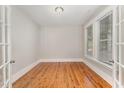 Spacious home office with hardwood floors and large windows at 69 Fallenwood Ln, Chapel Hill, NC 27516