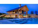 Resort-style pool and clubhouse at night at 2541 Lillian Woods Way, Wendell, NC 27591