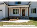 Front entryway showcasing craftsman style and stone accents at 775 Vick Rd, Spring Hope, NC 27882