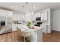 Modern kitchen with white cabinets, stainless steel appliances, and an island at 171 Periwinkle Pl # 232, Clayton, NC 27527