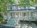 Two-story house with large porch, two car garage, and wooded setting at 2805 Prather Place Pl, Wake Forest, NC 27587