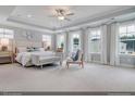 Spacious main bedroom with carpet and plenty of natural light at 279 N Maple Walk Dr # 216, Garner, NC 27529