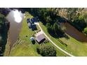 Luxury home nestled on a spacious lot with pond and outbuildings at 3700 Lark Farm Rd, Franklinton, NC 27525