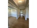 Bright and spacious foyer with hardwood floors and wainscoting at 23 Quail Point Cr, Clayton, NC 27520
