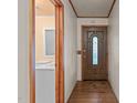 Inviting entryway with hardwood floors and wood door at 411 Southern St, Fuquay Varina, NC 27526