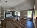 Open living room with hardwood floors and vaulted ceilings at 910 West St, Smithfield, NC 27577