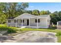 Newly renovated home with driveway and green lawn at 712 Blount St, Smithfield, NC 27577