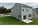 Gray house with sliding glass doors leading to patio at 87 Furley St., Homesite 112, Sanford, NC 27330