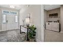 Entryway with view of laundry room and stylish console table at 167 Pretty Run Branch Ln, Wendell, NC 27591