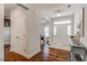 Bright entry hall with hardwood floors and view of the dining room at 167 Pretty Run Branch Ln, Wendell, NC 27591