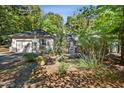 Single story home with attached garage and manicured landscaping at 675 Whitehurst, Pittsboro, NC 27312