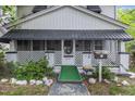 Front view of a white two-story house with a porch at 415 N Hyde Park Ave, Durham, NC 27703
