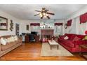 Living room with hardwood floors, fireplace and two sofas at 415 N Hyde Park Ave, Durham, NC 27703