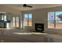 Bright living room with fireplace and large windows at 421 Ravensworth Dr, Garner, NC 27529