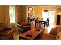 Bright dining room featuring a wood table and comfortable seating at 568 Log Barn Rd, Pittsboro, NC 27312