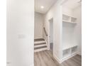 Bright entryway with built-in shelving and stairs leading upstairs at 112 N Guthrie Ave # A, Durham, NC 27703