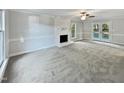 Bright and airy living room with neutral carpeting and fireplace at 2504 Timothy Dr, Fuquay Varina, NC 27526