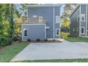 Modern home with gray siding, deck, and driveway at 112 N Guthrie Ave # B, Durham, NC 27703