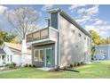 Gray modern home with a deck and landscaping at 112 N Guthrie Ave # C, Durham, NC 27703
