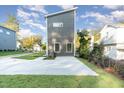 Side view of modern home with concrete driveway at 112 N Guthrie Ave # C, Durham, NC 27703