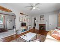 Cozy living room features hardwood floors, fireplace, and ample natural light at 113 Higbee St, Durham, NC 27704