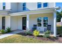 Front porch detail with rocking chairs and landscaping at 3010 Garner Rd # 101, Raleigh, NC 27610